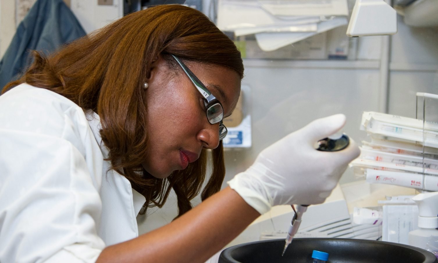 woman-scientist-at-work-in-lab-doing-research-aspect-ratio-1506-906
