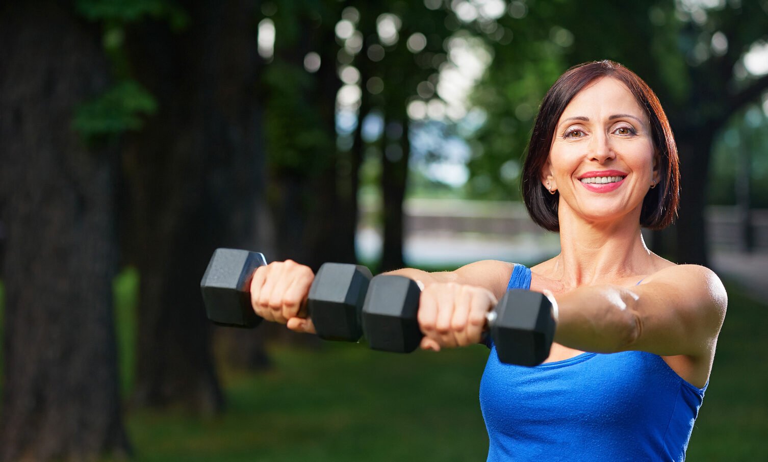 fitness_woman_with_weights_40-45-happy_landscape-web_2-aspect-ratio-1506-906