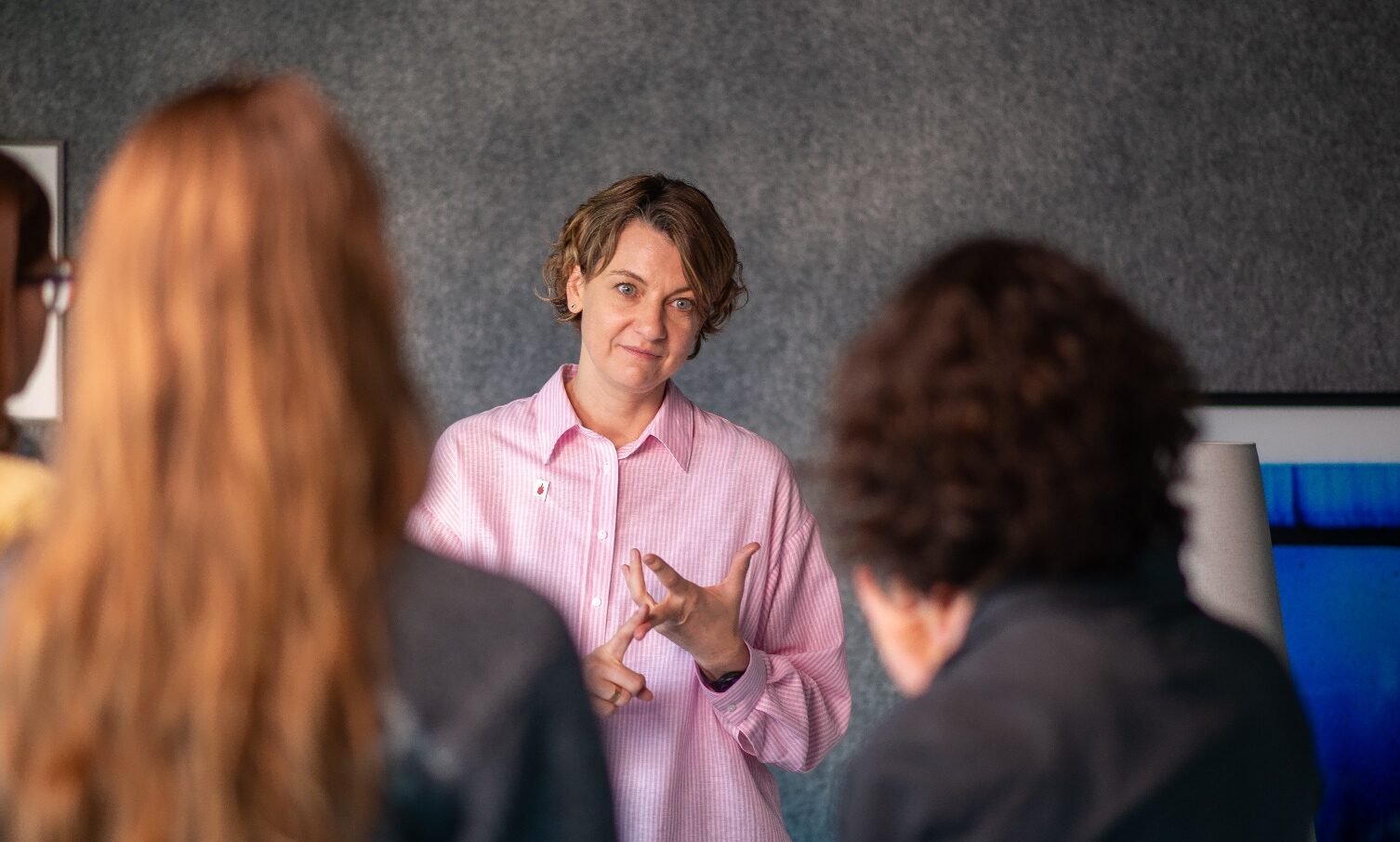 Jura_Lasas_sitting_by_the_table_serious_pink_shirt_landscape_web-aspect-ratio-1506-906